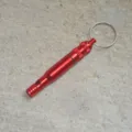 Red aluminum survival whistle with waterproof compartment and keyring for outdoor emergency use - Red