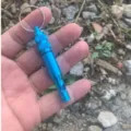 Blue aluminum emergency survival whistle with keyring and waterproof compartment for outdoor gear. - Sky Blue
