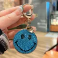 Sparkling blue rhinestone smiley face keychain with love heart pendant for bags and keys. - Lake Blue