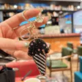 Detailed view of rhinestone ice cream keychain, sparkling crystal bag charm and accessory. - Black