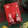 Boucles d'oreilles boule de Noël rouges en alliage avec flocons sur carte. - Boucles d'Oreilles Pendentif Boule de Noël Rouge (SD1122)