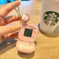 Mini retro handheld game console keychain, cute space rabbit design pocket toy for kids. - Pink