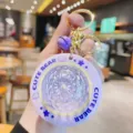 Purple UFO glowing keychain with cute bear design, perfect bag pendant and stylish accessory. - Purple
