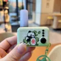 Cute cartoon panda luminous decompression keychain with mahjong tile, portable bag pendant. - Green Panda Jump Light
