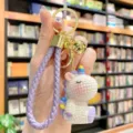Cute resin unicorn keychain with purple braided strap and gold ring, perfect bag charm gift. - Purple