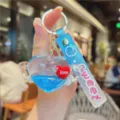 Cute liquid glitter heart keychain with angel wings and sweet strap pendant detail. - Blue