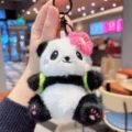 Cute panda plush keychain with pink flower and mini backpack, soft fluffy bag pendant - Red Flower Panda (Fa)