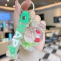 Cute acrylic quicksand candy house keychain girl doll bag pendant with silicone strap - Green