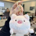 Cute plush pink pig keychain detail shot, fluffy animal doll charm for keys and bags. - Pink Pig