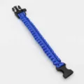 Close-up detail of the durable blue paracord survival bracelet featuring a sturdy black buckle. - Sapphire Blue