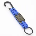 Detailed close-up of blue braided paracord keychain with black metal carabiner and flag tag. - Royal Blue
