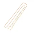 Detail view of a stylish gold metal glasses chain featuring lovely heart crystal beads and silicone loops. - Pale Green