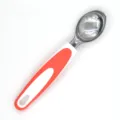 Stainless steel ice cream scoop with white and orange handle, perfect for home kitchen use. - Orange Red
