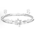 Close-up of the delicate star bracelet featuring paved zircon, hollow stars, and handmade white cord. - Star Style