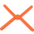 Foldable silicone hot trivet mat, orange cross pad for kitchen cookware heat protection. - Orange