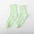 Light green fuzzy coral fleece crew socks with anti-slip grip soles for winter sleep home - One Size / Autumn Green