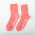 Thickened coral fleece fuzzy winter socks in coral pink with non-slip dispensing grip soles. - One Size / Tomato Red