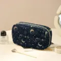 Dark blue corduroy makeup bag with celestial sun and moon stars pattern for travel. - Moon Star