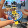 Close-up of mini finger basketball machine keychain toy, portable cartoon design, bag pendant. - Blue Yellow Basket No Sound Light