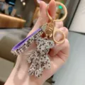 Portachiavi orsetto con strass, cristalli brillanti, cinturino viola, finiture dorate. - Viola Misto