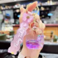 Cute purple liquid quicksand keychain detail, featuring glitter ice cream pendant and bow strap. - Fruit Popsicle - Grape