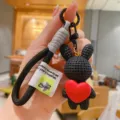Cute resin cartoon rabbit keychain with red heart pendant, stylish bag charm and key chain. - Black