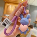 Cute resin heart bunny keychain with purple wrist strap, detailed charm close-up view. - Purple