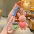Cute resin knit rabbit keychain with heart pendant, blue lanyard detail, bag charm accessory. - Pink