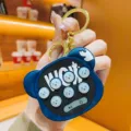 Detailed view of cute bear head whack-a-mole game keychain, creative silicone toy keyring pendant. - Blue