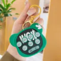 Cute bear shaped mini electronic game console keychain with cute silicone buttons and ring. - Green
