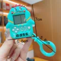 Cartoon dinosaur handheld game console keychain, retro mini electronic game toy pendant, green. - Green