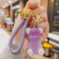 Creative rhinestone jelly bear keychain, exquisite purple PU braided rope and gold metal pendant. - Purple