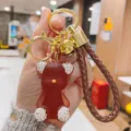 Rhinestone jelly bear keychain with braided leather strap, luxury bag pendant accessory. - Coffee