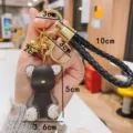 Cute rhinestone jelly bear keychain with braided leather strap and cute metal bell charm. - Black