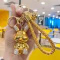 Gold rabbit keychain with sparkling rhinestones and woven strap bag charm variant - Gold
