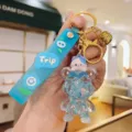 Detailed close-up of cute liquid glitter bear keychain with adorable cat and blue strap. - Sky Blue