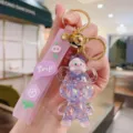 Cute cartoon quicksand bear keychain with cat pendant, stylish bag charm and key ring. - Violet