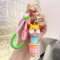 Cute cartoon shiba inu ice cream keychain detail, silicone accessory and metal ring display. - Telescopic Ice Cream Animal - Yellow Dog