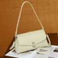 Chic off-white leather shoulder bag with metal clasp, elegant retro design for daily commute. - Off White