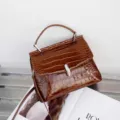 Exquisite crocodile pattern brown handbag detail, elegant top handle crossbody bag for women. - Brown