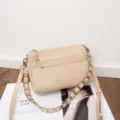 Detailed view of a stylish beige genuine leather crossbody bag with multiple zippers and chain. - 27*7*17CM / Milk Tea