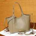 Details of stylish casual shoulder tote bag featuring clean stitching and metal hardware. - Squirrel Gray