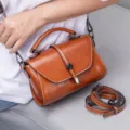 Retro oil-wax leather women shoulder bag with top handle and removable strap detail. - Caramel color