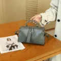 Detailed view of genuine leather Boston bag, retro vegetable-tanned shoulder handbag with top handle. - 25x15x11 cm / Gray