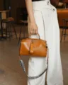 Detail shot of vintage genuine leather Boston bag, premium cowhide crossbody style with strap. - 25x15x11 cm / Yellow