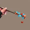 Exquisite Chinese style wooden hair stick featuring elegant persimmon and enamel flower design. - Blue Flower Persimmon Tassel Wooden Hair Stick
