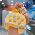 Mini space astronaut gamepad keychain detail view, cute yellow portable toy bag pendant. - Lemon Yellow