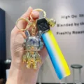 Schattige gegalvaniseerde metalen konijnen sleutelhanger met een kleurrijke verloopband. - Gegalvaniseerd Masker Konijn - Zilver en Geel Verloop