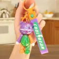 Colorful PVC bear keychain, trendy cartoon bag pendant with electroplated finish and strap. - Electroplated Color Block Bear - Purple and Green