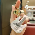 Cute guitar shaped keychain with mini music toy function, metal ring and bell bag pendant charm. - Music Guitar / Pink